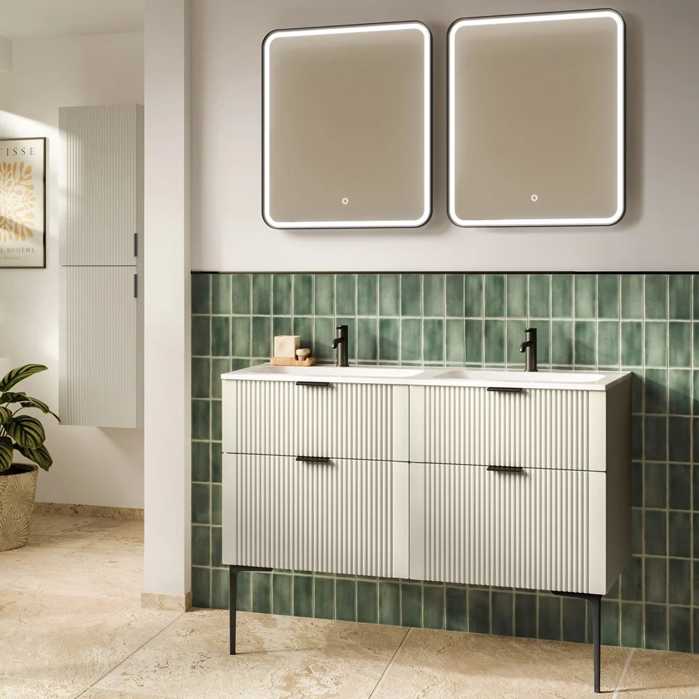 Phoenix Groove fluted double vanity unit with twin basins, illuminated LED mirrors, black brassware, and green feature wall tiles.
