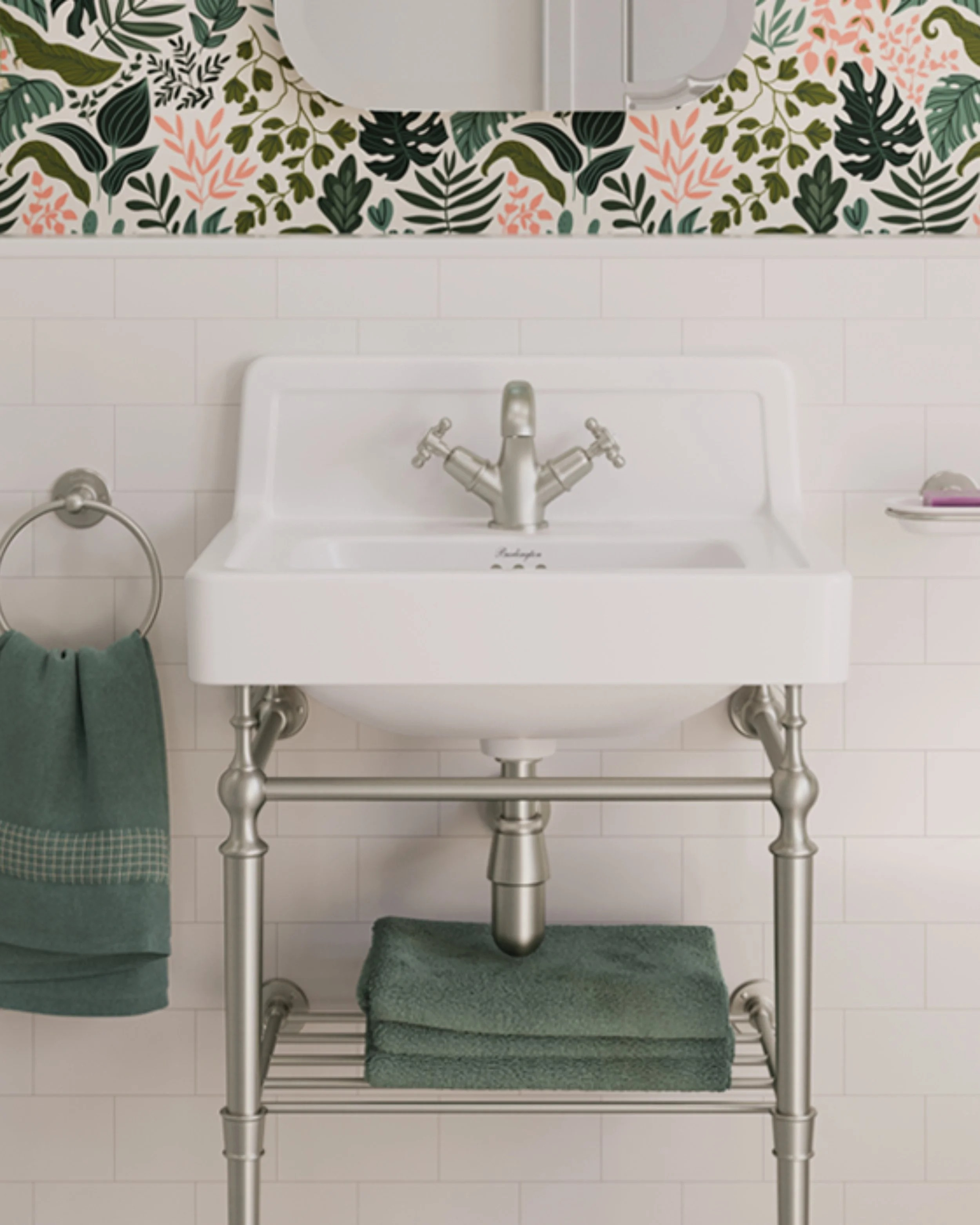 Traditional white ceramic cloakroom basin with chrome washstand, classic mixer tap, and decorative botanical wallpaper from Island Bathrooms.